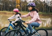 two girls riding on bikes